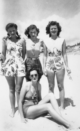 Friends posing on Kirra Beach, 1938