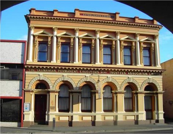 A fine classical building with perfect symmetry in Launceston. Now a bank. Note arched windows on ground floor and rectangular windows above.