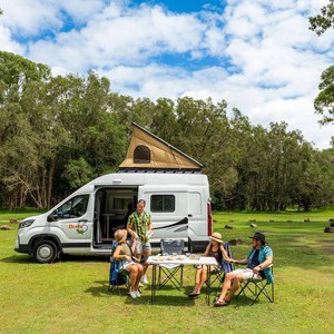 Britz Voyager AU Couple Dining beside Camper