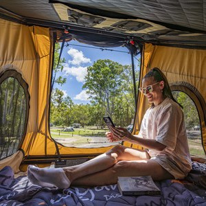 Britz Voyager AU Woman Reading in Pop-top Roof Tent