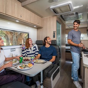 Mighty Big Six AU Man Cooking for Group at Dining Table