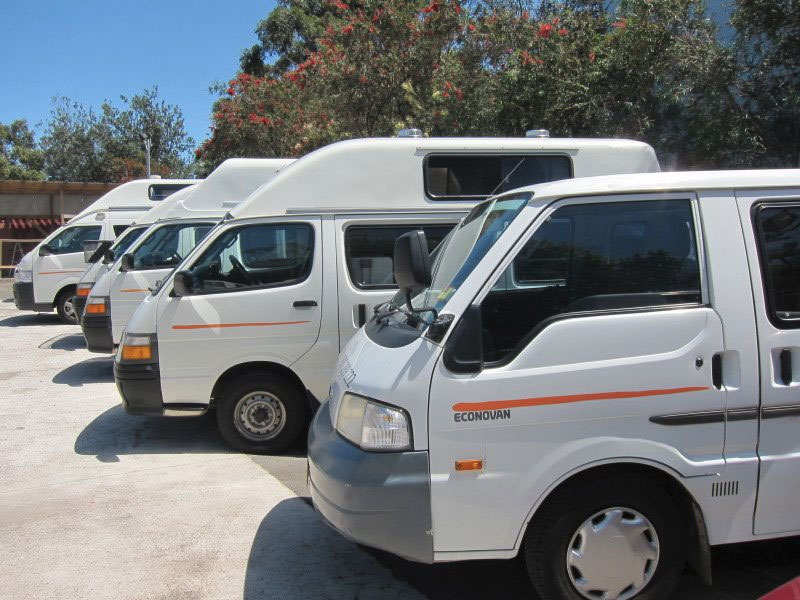 Different types of campervans lined up available for rental