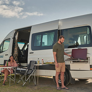 maui-ultima-2-berth-motorhome-exterior-couple-bbq