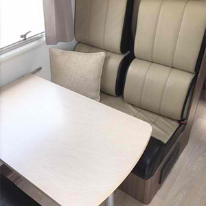 Serenity Conquest Slideout Motorhome – 5 Berth – table and seat