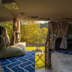 AW CP Campervan – 2 Berth AU Interior Bed And Outdoor View