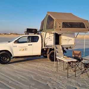 bb-extra-cab-4×4-2-berth-exterior-with-camping-chairs-and-table