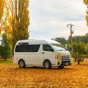 AW HP Campervan – 3 Berth AU Exterior Autumn Campsite View AW HP Campervan – 3 Berth AU Exterior Autumn Campsite View