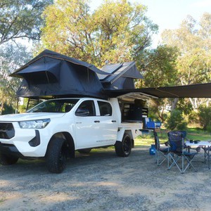GC Toyota Hilux 4WD – 2-5 Berth AU campsite setup with awning and camp chairs